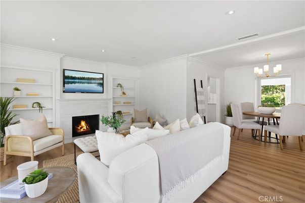 Chandelier, Dining room, Fireplace, Interior, Living room, Recessed Lighting, Wood Texture Flooring