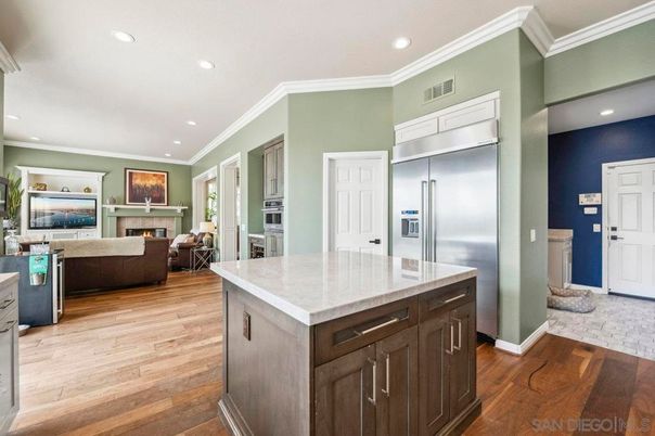 Fireplace, Interior, Kitchen, Living room, Recessed Lighting, Stainless Steel Appliances, Wood Texture Flooring