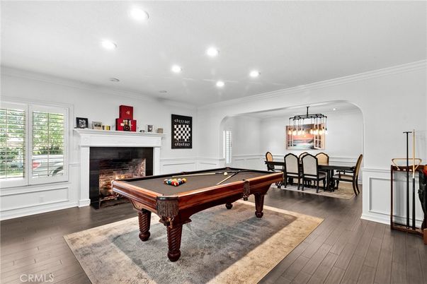 Billiard Table, Chandelier, Dining room, Fireplace, Game Room, Interior, Pendant Lights, Recessed Lighting, Wood Texture Flooring