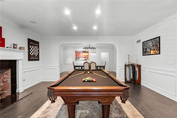 Billiard Table, Fireplace, Game Room, Interior, Pendant Lights, Recessed Lighting, Wood Texture Flooring