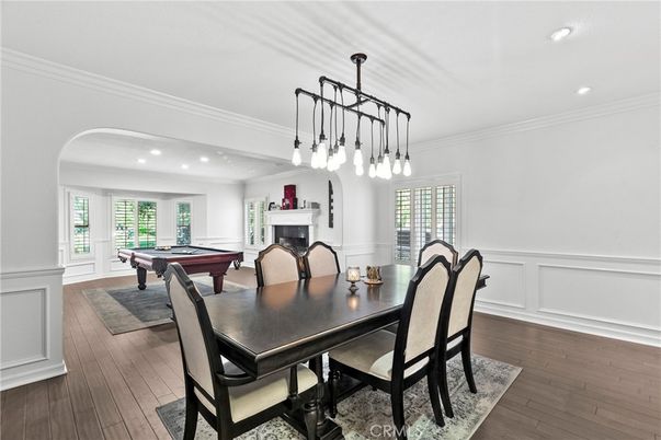 Billiard Table, Dining room, Fireplace, Game Room, Interior, Pendant Lights, Recessed Lighting, Wood Texture Flooring