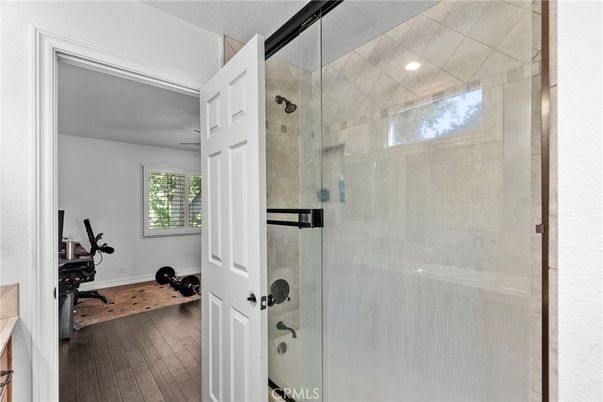 Bathroom, Fitness Equipment, Glass Shower, Interior, Recessed Lighting, Wood Texture Flooring