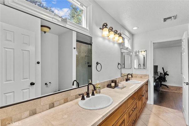Bathroom, Dual Sink Vanities, Interior, Recessed Lighting, Tile Countertops, Wood Texture Flooring