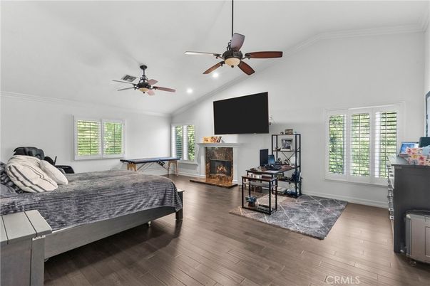 Bedroom, Fireplace, Interior, Recessed Lighting, Wood Texture Flooring