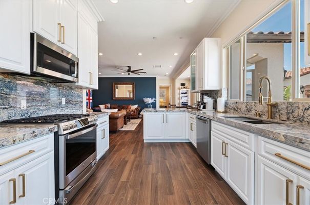 Dining room, Interior, Kitchen, Living room, Recessed Lighting, Stainless Steel Appliances, Wood Texture Flooring