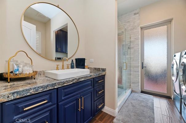 Bathroom, Dual Sink Vanities, Glass Shower, Interior, Wood Texture Flooring