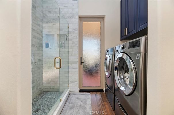 Bathroom, Glass Shower, Interior, Washer, Wood Texture Flooring