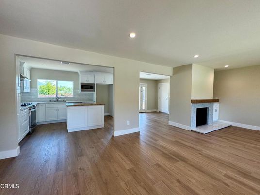 Empty room, Fireplace, Interior, Kitchen, Recessed Lighting, Wood Texture Flooring
