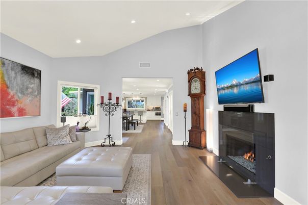 Dining room, Fireplace, Interior, Living room, Pendant Lights, Recessed Lighting, Wood Texture Flooring