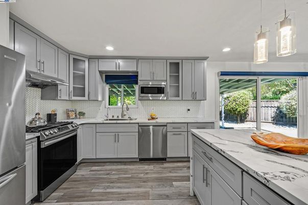 Interior, Kitchen, Pendant Lights, Recessed Lighting, Stainless Steel Appliances, Wood Texture Flooring