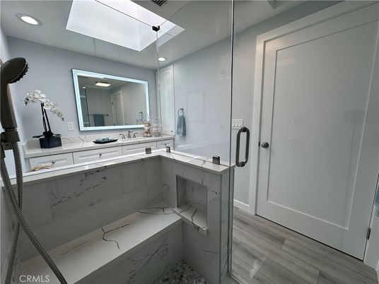 Bathroom, Glass Shower, Interior, Marble Walls, Recessed Lighting, Wood Texture Flooring