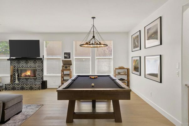 Billiard Table, Fireplace, Game Room, Interior, Pendant Lights, Wood Texture Flooring