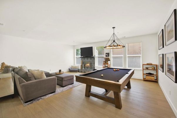 Billiard Table, Fireplace, Game Room, Interior, Living room, Pendant Lights, Wood Texture Flooring