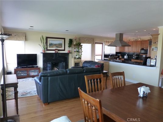 Dining room, Fireplace, Interior, Kitchen, Living room, Recessed Lighting, Stainless Steel Appliances, Wood Texture Flooring