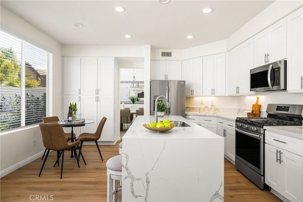 Dining room, Interior, Kitchen, Recessed Lighting, Stainless Steel Appliances, Wood Texture Flooring