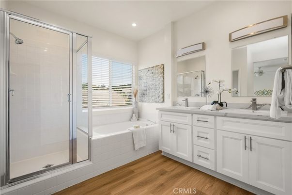 Bathroom, Dual Sink Vanities, Glass Shower, Interior, Recessed Lighting, Wood Texture Flooring