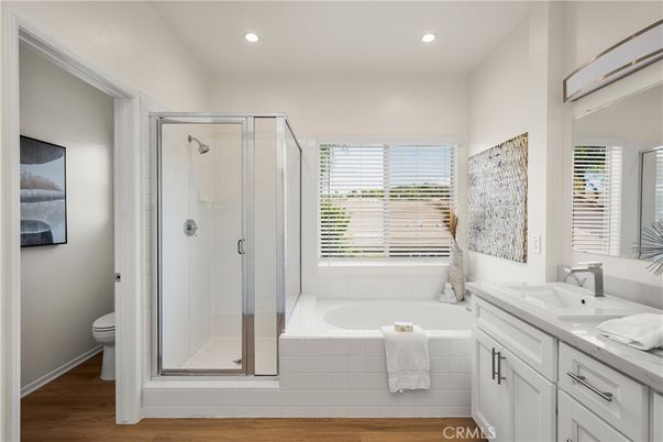 Bathroom, Dual Sink Vanities, Glass Shower, Interior, Recessed Lighting, Wood Texture Flooring