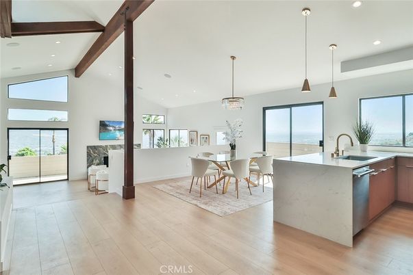 Chandelier, Dining room, Fireplace, Interior, Kitchen, Pendant Lights, Recessed Lighting, Water, Wooden Beams, Wood Texture Flooring