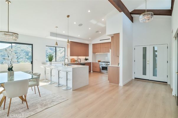 Chandelier, Dining room, Interior, Kitchen, Pendant Lights, Recessed Lighting, Stainless Steel Appliances, Wooden Beams, Wood Texture Flooring
