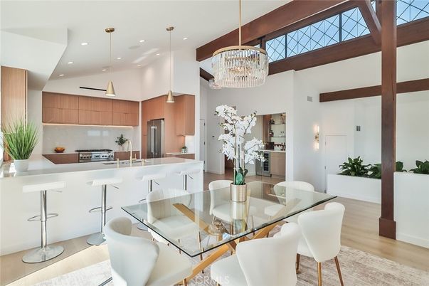 Chandelier, Dining room, Interior, Kitchen, Pendant Lights, Recessed Lighting, Stainless Steel Appliances, Wood Texture Flooring