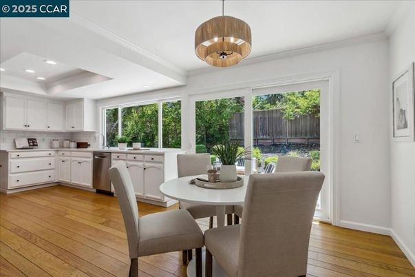 Dining room, Interior, Kitchen, Pendant Lights, Recessed Lighting, Stainless Steel Appliances, Wood Texture Flooring