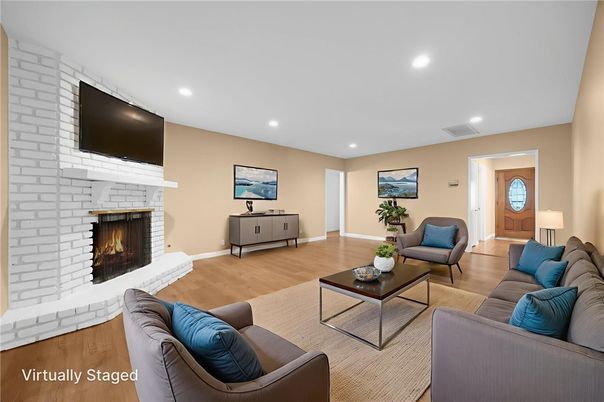 Fireplace, Interior, Living room, Recessed Lighting, Stone Walls, Wood Texture Flooring