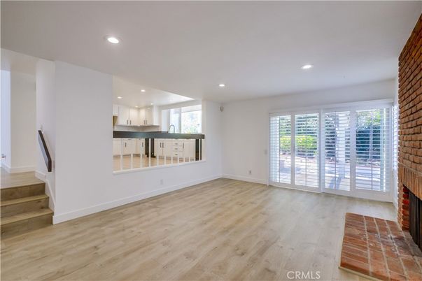 Empty room, Fireplace, Interior, Kitchen, Recessed Lighting, Wood Texture Flooring