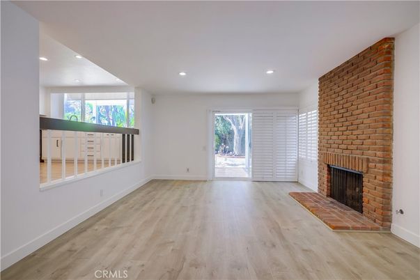 Empty room, Fireplace, Interior, Recessed Lighting, Stone Walls, Wood Texture Flooring