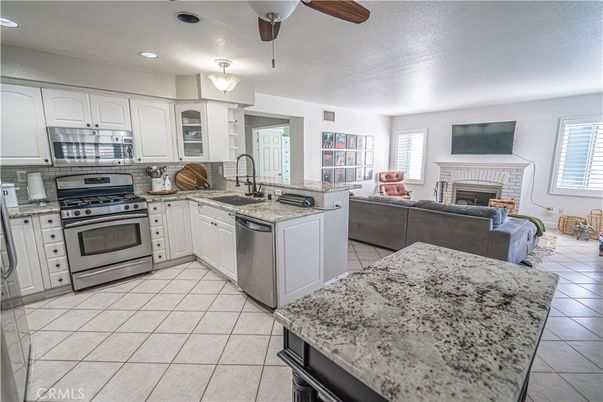 Fireplace, Interior, Kitchen, Living room, Recessed Lighting, Stainless Steel Appliances