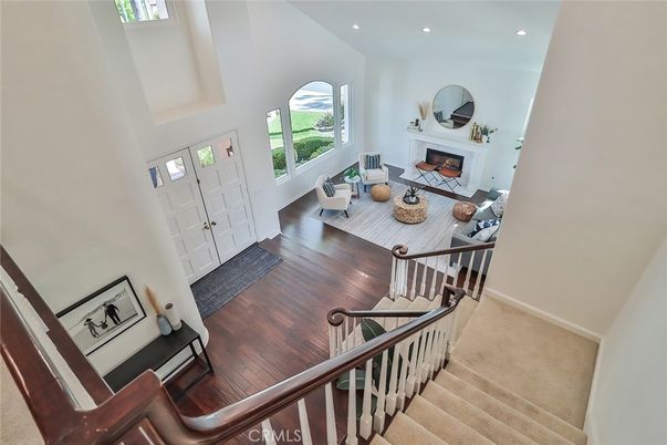 Dining room, Fireplace, Interior, Living room, Recessed Lighting, Wood Texture Flooring