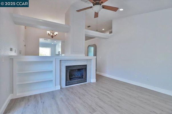 Chandelier, Empty room, Fireplace, Interior, Recessed Lighting, Wood Texture Flooring