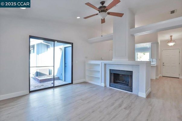 Empty room, Fireplace, Interior, Pendant Lights, Recessed Lighting, Wood Texture Flooring