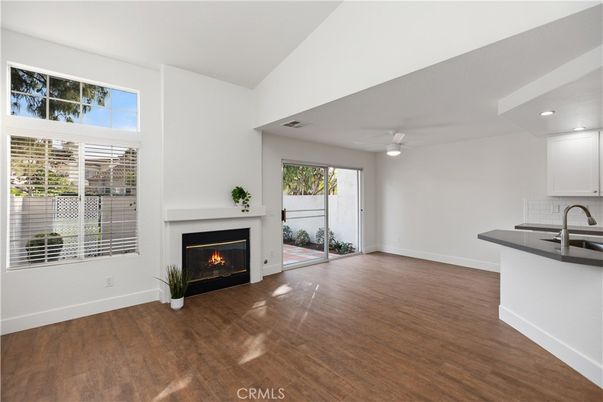 Empty room, Fireplace, Interior, Kitchen, Recessed Lighting, Wood Texture Flooring