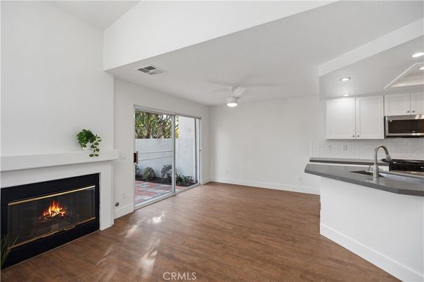 Empty room, Fireplace, Interior, Kitchen, Recessed Lighting, Wood Texture Flooring