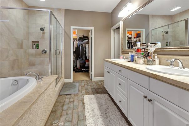 Bathroom, Dual Sink Vanities, Glass Shower, Interior, Recessed Lighting, Walk-in Closets, Wood Texture Flooring