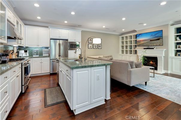 Fireplace, Interior, Kitchen, Living room, Recessed Lighting, Stainless Steel Appliances, Wood Texture Flooring