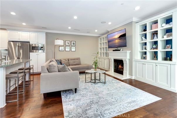Fireplace, Interior, Kitchen, Living room, Recessed Lighting, Stainless Steel Appliances, Wood Texture Flooring