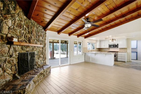 Empty room, Fireplace, Interior, Kitchen, Pendant Lights, Stone Walls, Wooden Beams, Wooden Ceilings, Wood Texture Flooring