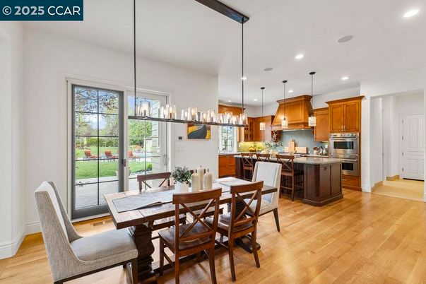 Dining room, Interior, Kitchen, Pendant Lights, Recessed Lighting, Stainless Steel Appliances, Wood Texture Flooring