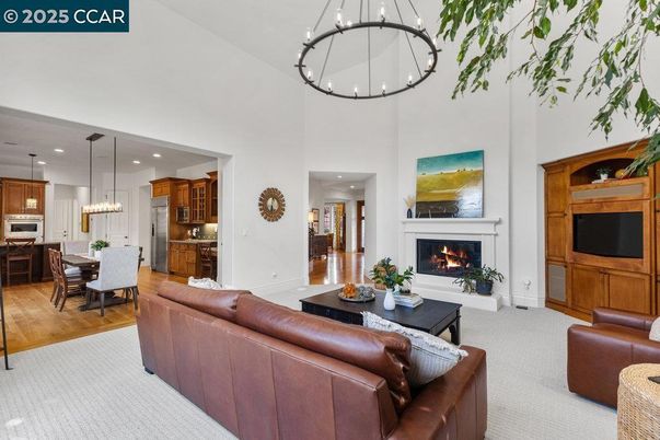 Dining room, Fireplace, Interior, Kitchen, Living room, Pendant Lights, Recessed Lighting, Stainless Steel Appliances, Wood Texture Flooring