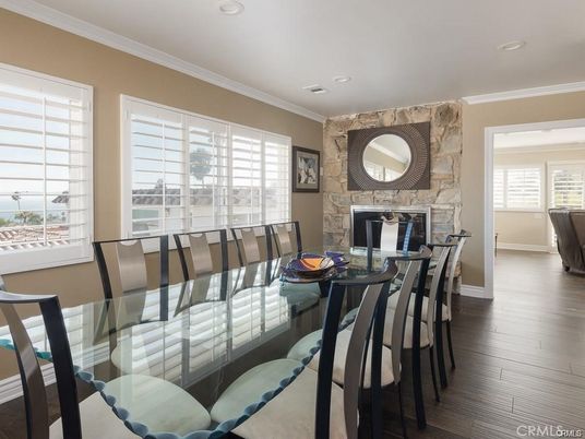 Dining room, Fireplace, Interior, Recessed Lighting, Stone Walls, Wood Texture Flooring