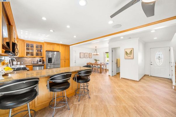 Dining room, Interior, Kitchen, Pendant Lights, Recessed Lighting, Stainless Steel Appliances, Wood Texture Flooring