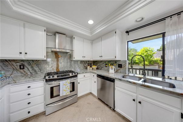 Interior, Kitchen, Marble Walls, Recessed Lighting, Stainless Steel Appliances