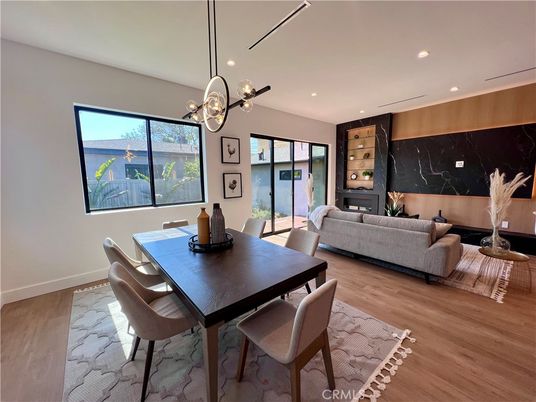 Dining room, Fireplace, Interior, Living room, Pendant Lights, Recessed Lighting, Wood Texture Flooring