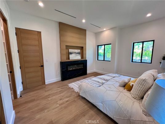 Bedroom, Fireplace, Interior, Recessed Lighting, Wood Texture Flooring
