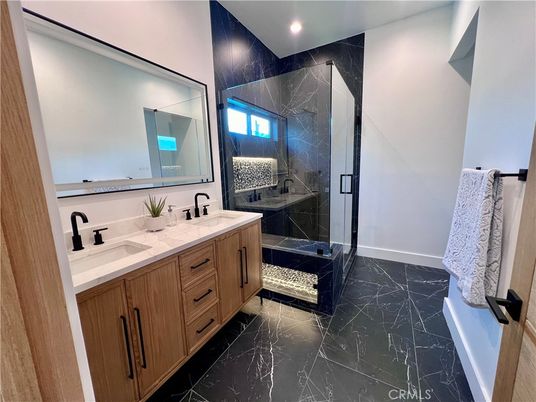 Bathroom, Dual Sink Vanities, Glass Shower, Interior, Marble, Marble Walls, Recessed Lighting