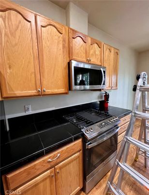 Interior, Kitchen, Tile Countertops, Wood Texture Flooring