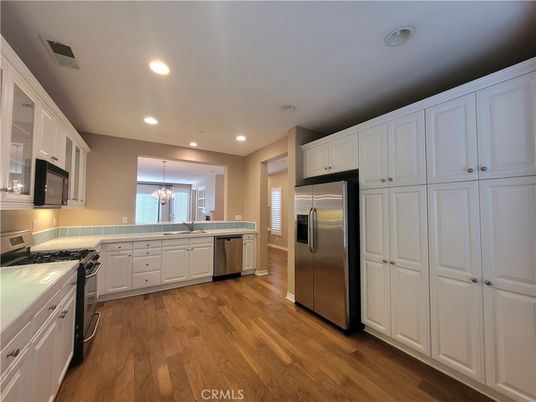Chandelier, Interior, Kitchen, Recessed Lighting, Stainless Steel Appliances, Wood Texture Flooring