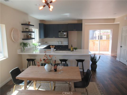 Dining room, Interior, Kitchen, Pendant Lights, Recessed Lighting, Stainless Steel Appliances, Wood Texture Flooring