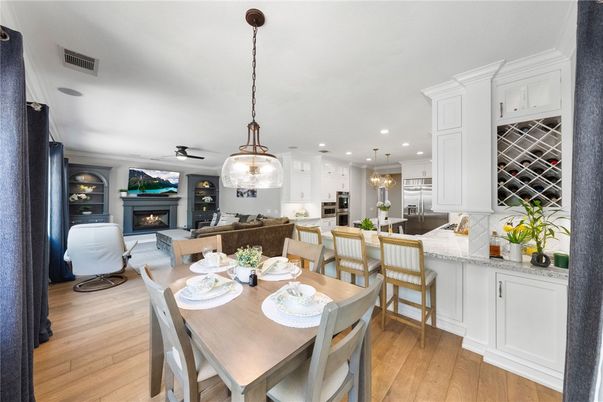 Dining room, Fireplace, Interior, Kitchen, Living room, Pendant Lights, Recessed Lighting, Wood Texture Flooring